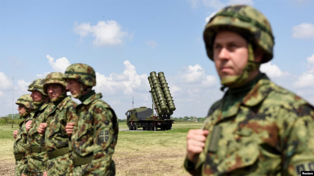 Serbian Army soldiers stand near a Chinese medium-range FK-3 missile system during a demonstration of their country's air defense capabilities