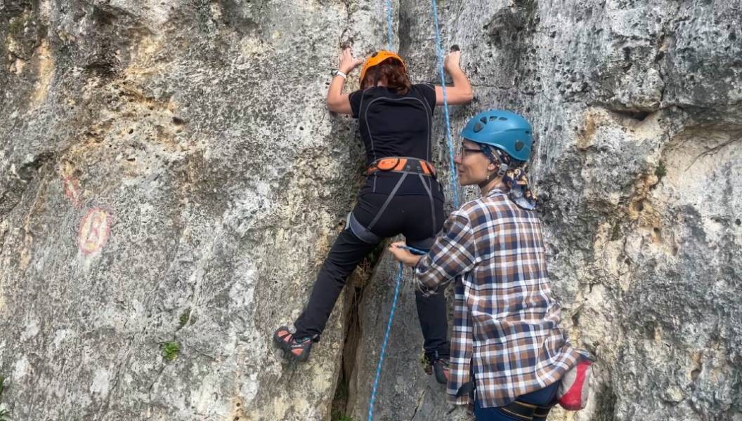 First steps in rock climbing are made with the help of an instructor