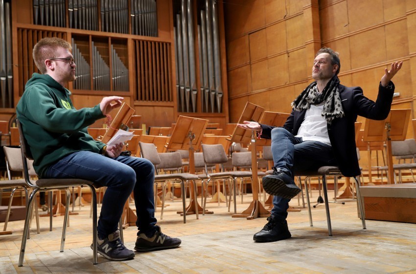 Boian Bochev talks to Sascha Goetzel on the stage of Bulgaria Concert Hall