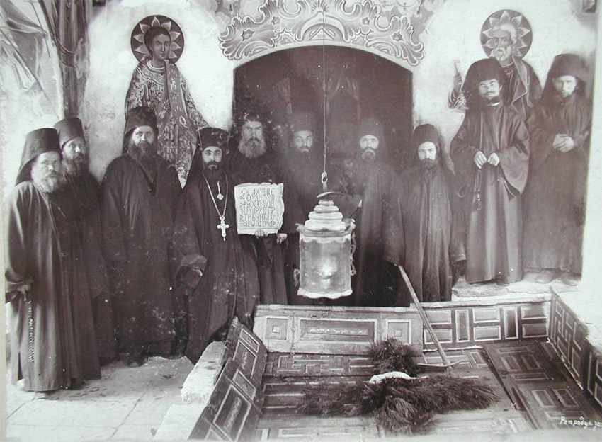 The monastic brotherhood of the Bachkovo Monastery in front of the uncovered grave of St. Euthymius