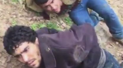A frame from the video showing the Afghan migrants on the ground