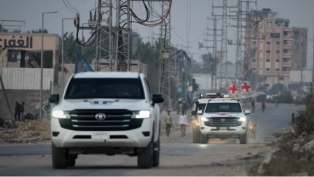 Red Cross vehicles carrying the bodies of two deceased hostages handed over by Hamas 