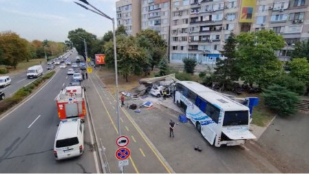 A bus transporting migrants ploughed into a police car and a bus stop