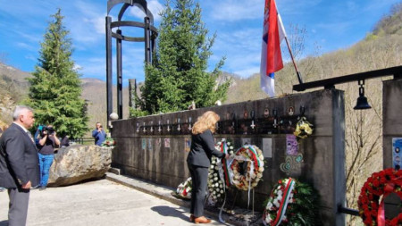 Vice President Iliana Iotova lays a wreath at the memorial for the 12 children who died when their bus plunged into the Lim river.