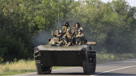 Ukrainian servicemen ride APC on a road near the small city of Bakhmut of Donetsk area, 08 June 2022. 