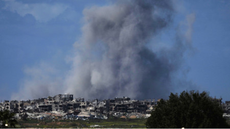 Smoke rises following an Israeli bombardment in the Gaza Strip, as seen from southern Israel, Wednesday, March 19, 2025.