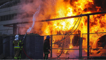 Emergency services responding to a fire after shelling in Kyiv Ukraine, 18 October 2022. Three Russian strikes hit an energy infrastructure facility in Kyiv