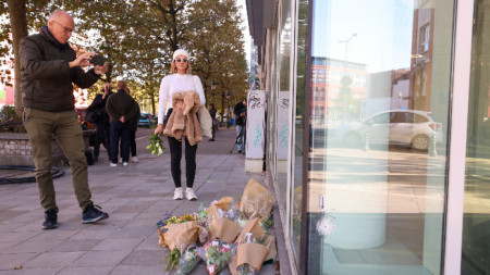 Flowers are placed outside the bank branch where two Swedish soccer fans were shot dead in a terrorist attack in Brussels, Belgium, October 17, 2023.