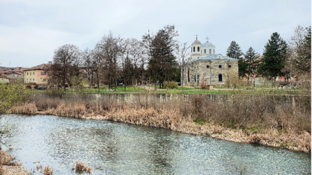 Zlatna Panega river, in the background St George the Great Martyr church in the town of Lukovit.